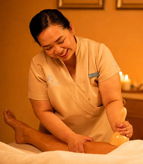 Therapist providing home massage service Dubai